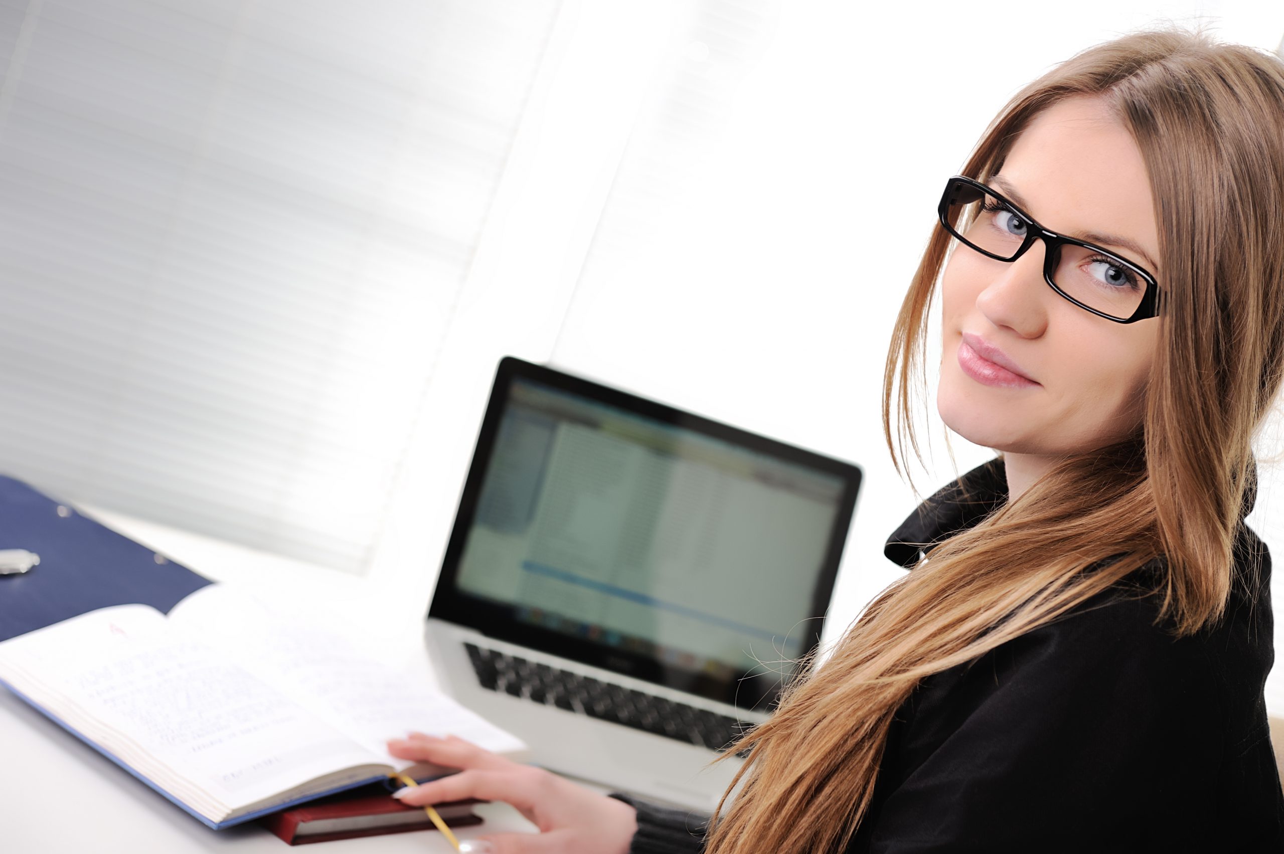 Business Female infront of a Computer